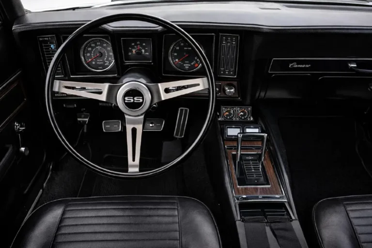 Interior view of a 1969 Chevrolet Camaro SS showing the original dashboard layout, three-spoke SS steering wheel, correct instrument cluster with round gauges, and center console configuration typical of a Super Sport equipped first-generation Camaro