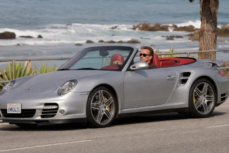 Arnold Schwarzenegger's silver Porsche 997 Turbo Cabriolet with red interior representing the high performance European sports car in his collection with a 3.8 liter twin turbocharged flat-6 engine producing 572 horsepower and reaching 60 mph in 3.4 seconds estimated at approximately 216000 dollars and regularly driven by Schwarzenegger with the top down on California's coastal roads making it the most purely sports car experience in a collection dominated by convertibles and open top vehicles