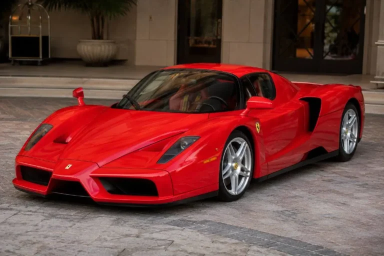 Ferrari Enzo owned by 50 Cent Curtis Jackson one of only 400 Ferrari Enzo units ever produced as a tribute to company founder Enzo Ferrari using a naturally aspirated 6.0 liter V12 engine producing 651 horsepower reaching 60 mph in under 3.5 seconds currently valued at approximately 2.4 million to 3 million dollars depending on mileage and condition making it the crown jewel of 50 Cent's 10.5 million dollar car collection and one of the rarest road cars owned by any celebrity in the world