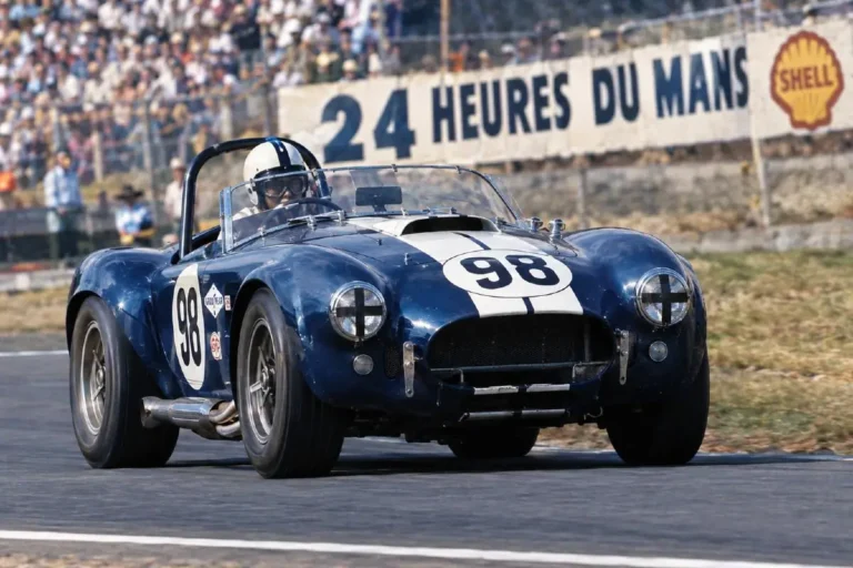 Shelby Cobra in SCCA A-Production racing competition during the 1963 or 1964 season showing the car that won SCCA national championships in both years with drivers including Ken Miles Bob Bondurant and Dave MacDonald establishing the Shelby Cobra as the dominant force in American sports car racing before the program escalated to the FIA World Manufacturers Championship assault that produced the 1965 title win against Ferrari the first American manufacturer to win that championship