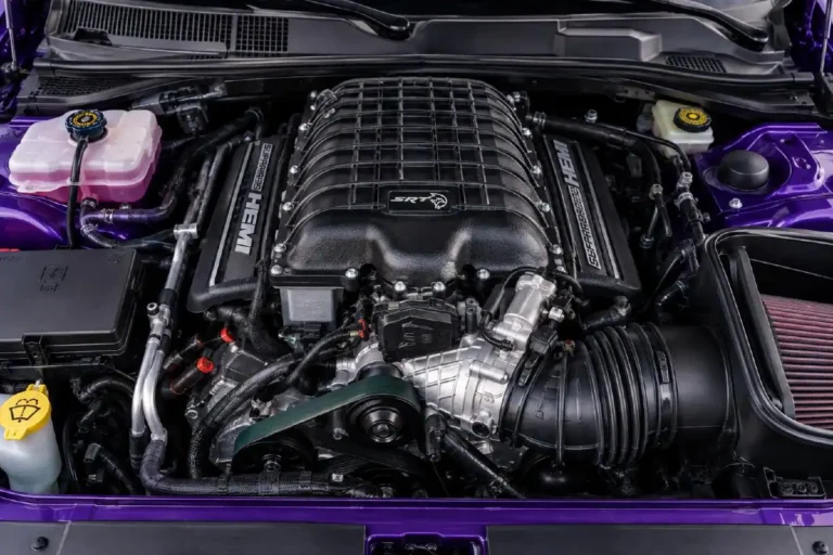 6.2-liter supercharged HEMI V8 engine in the Dodge Challenger SRT Hellcat engine bay showing the 2.4-liter twin-screw supercharger unit mounted on top of the engine producing 717 horsepower and 650 lb-ft of torque in the 2015 Challenger Hellcat introduction with subsequent versions producing 797 horsepower in the Hellcat Redeye and 807 horsepower in the Super Stock using the same basic architecture that culminated in the Demon 170's 1025 horsepower output