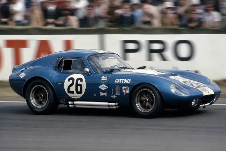 Shelby Cobra Daytona Coupe designed by Peter Brock and built by Shelby American showing the closed aluminum body that replaced the open roadster design to win the 1965 FIA World Sportscar Championship GT class the first and only time an American car has won that international championship outright with only six examples ever built using a 7.0 liter Ford V8 engine in a hand-formed aluminum body that was approximately 20 mph faster than the open roadster design