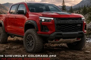 2026 Chevrolet Colorado ZR2 or Trail Boss midsize pickup truck in outdoor setting showing the bold exterior design and available off-road capability of the midsize truck available in five trims from the WT Work Truck at 34495 dollars through the LT Trail Boss Z71 and ZR2 all powered by the same 2.7-liter TurboMax turbocharged four-cylinder producing 310 horsepower and 430 lb-ft of torque with class-leading 7700-pound maximum towing capacity and an 11.3-inch touchscreen standard across all trims