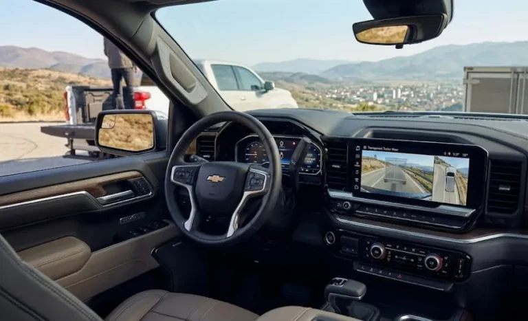 2026 Chevrolet Silverado 1500 interior showing the large infotainment touchscreen with transparent trailer view camera technology and the MultiPro tailgate in one of its six functional positions representing the Edmunds-recognized Fantastic tech package that is the Silverado's primary competitive strength in the full-size truck segment starting around 37000 dollars with reasonable prices and expansive options making it a strong value choice in the competitive full-size truck market