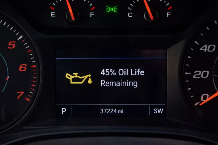 Vehicle instrument cluster showing oil life monitoring system percentage display demonstrating the correct way to determine when an oil change is due on modern cars equipped with General Motors Oil Life System Ford Intelligent Oil-Life Monitor or similar manufacturer oil condition tracking systems that replace fixed mileage intervals
