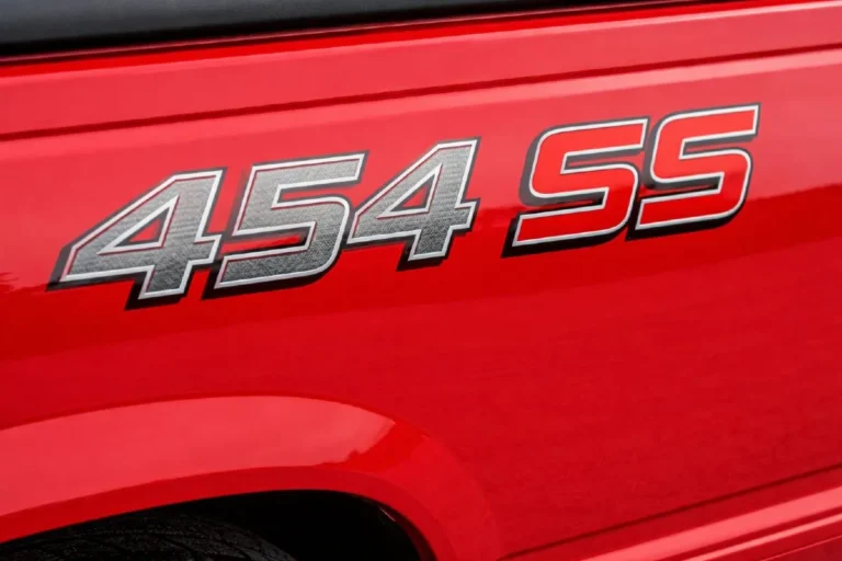 Close up detail of the authentic factory 454 SS bedside decal on a genuine Chevrolet C1500 454 SS truck showing the correct font placement and finish quality of the specific graphics package that along with the RPO code B4U on the SPID label and the 5 lug 14 bolt rear axle are the primary authentication markers distinguishing genuine 454 SS trucks from tribute conversions built from standard C1500 pickups