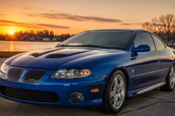 American muscle car representing the best used American sports cars available under 10000 dollars in 2026 including the Ford Mustang GT 1999 to 2009 with V8 engine the Chevrolet Camaro Z28 and SS 1998 to 2012 with LS1 engine the Pontiac GTO 2004 with 400 horsepower LS2 V8 the Pontiac Firebird Trans Am with LS1 the Dodge Challenger and the Chevrolet Corvette C5 all available for genuine performance car ownership at prices starting from 4500 dollars