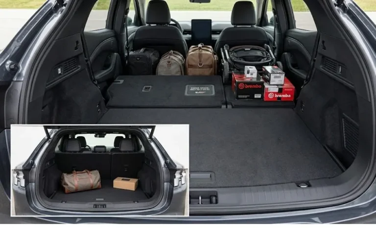 Ford Mustang Mach-E cargo area with rear seats folded showing 59.7 cubic feet of maximum cargo capacity representing one of the strongest practical ownership arguments for the 2026 Mach-E in the compact electric SUV segment with the panoramic glass roof visible above and the flat cargo floor that results from the rear seat fold providing usable space for furniture sporting equipment or luggage