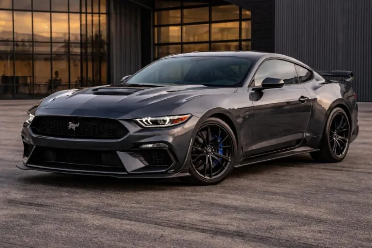 Ford Mustang Dark Horse in Dark Matter Gray Metallic showing the performance hood vent Brembo brake calipers visible through 19 inch wheels and the aggressive front fascia of the 500 horsepower modified Coyote V8 muscle car that achieves 0 to 60 mph in 3.7 seconds with the 10 speed automatic transmission - Fastest Ford 